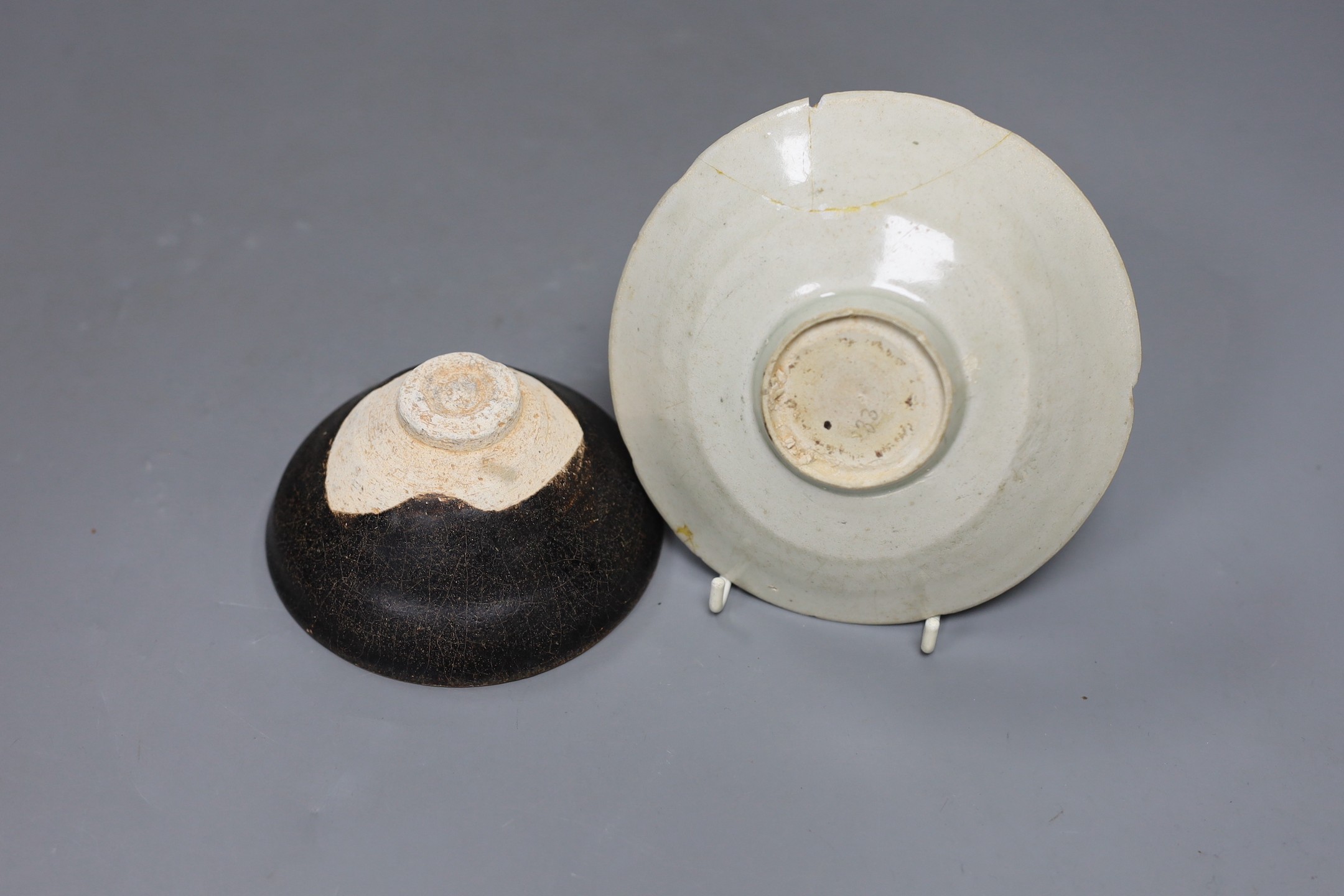 A Chinese Jizhou ‘scrolling leaf’ bowl, Song Dynasty, 11cm and a carved qingbai dish, 14cm